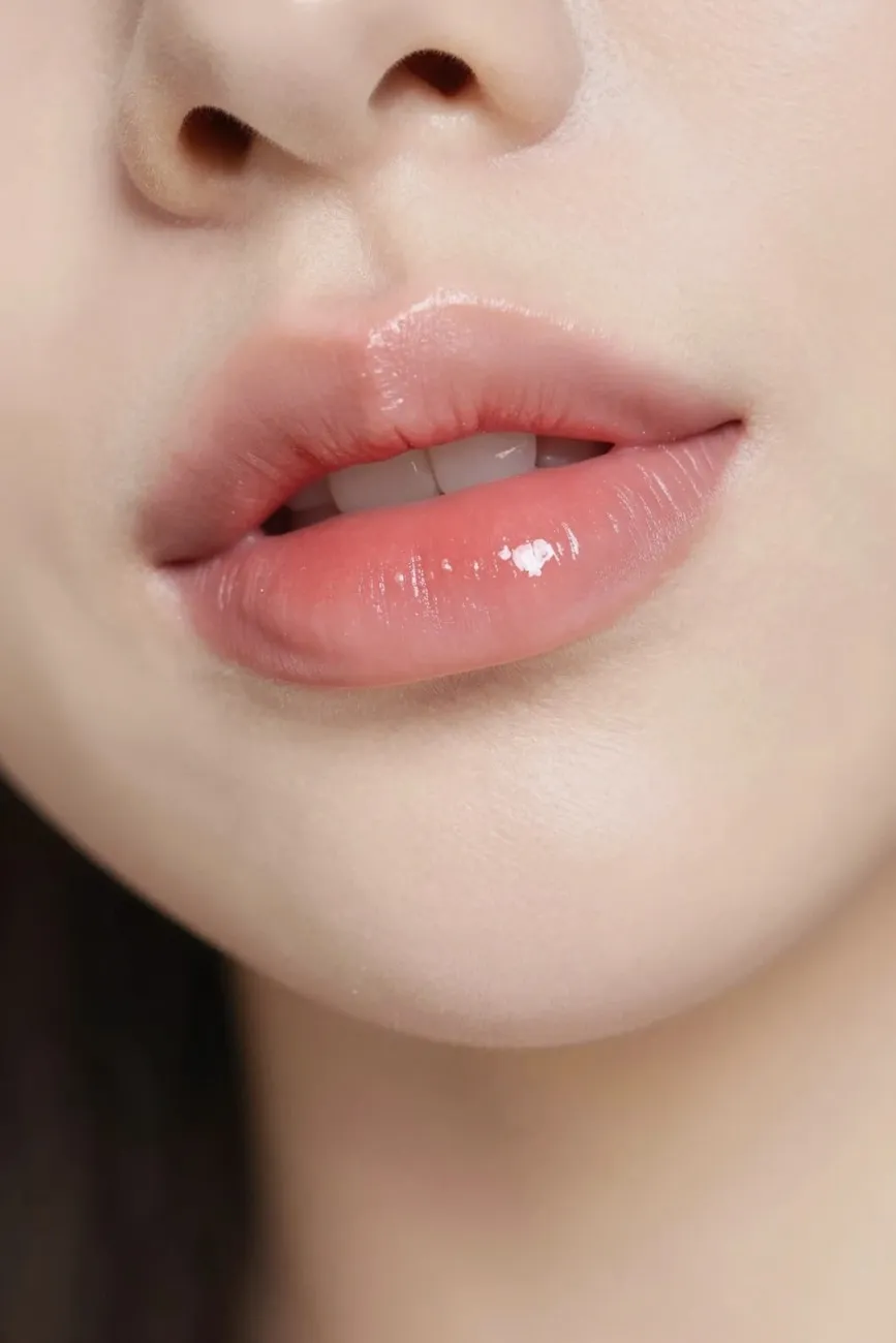Korean gradient lip technique showing soft center-dab ombre lips for a natural bitten-lip look